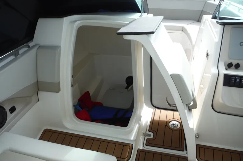 Slide: The Image of 2021 Boston Whaler 240 Vantage interior cabin with open door and teak flooring. - 26