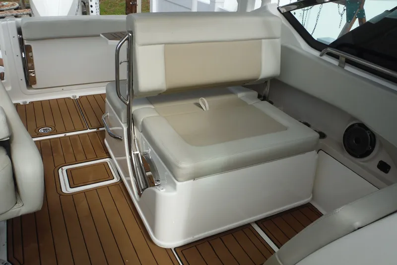 Slide: The Image of 2021 Boston Whaler 240 Vantage interior with cushioned seating and teak flooring. - 15