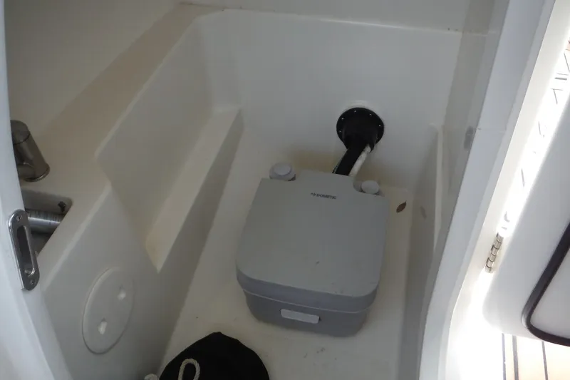 Slide: The Image of Interior of 2021 Boston Whaler 240 Vantage with portable marine toilet. - 24