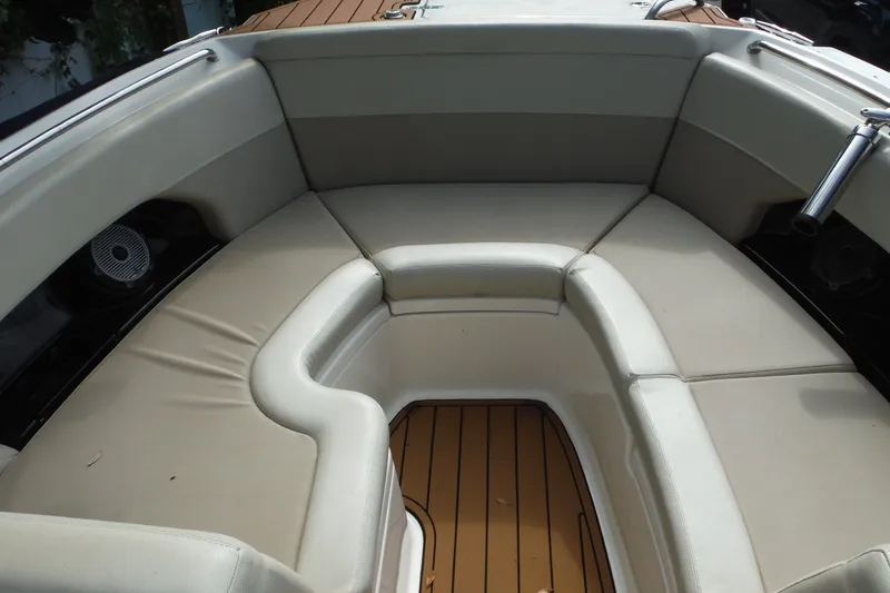 Slide: The Image of 2021 Boston Whaler 240 Vantage boat interior with cushioned seating and teak flooring. - 31