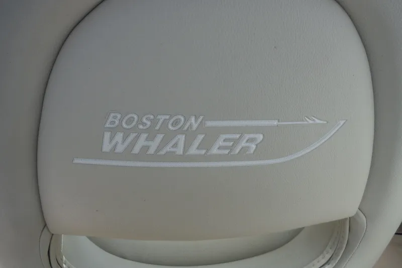 Slide: The Image of Boston Whaler 240 Vantage 2021 logo on beige boat seat. - 44