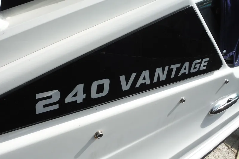 Slide: The Image of 2021 Boston Whaler 240 Vantage boat nameplate on white hull. - 47