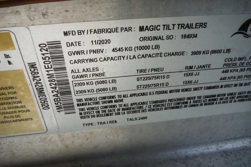 Slide: The Image of Label on Magic Tilt Trailer, manufactured 11/2020, showing weight and tire specifications. - 50