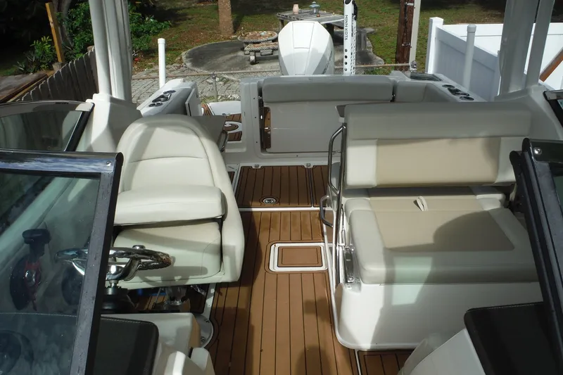 Slide: The Image of 2021 Boston Whaler 240 Vantage interior with seating and teak flooring. - 35
