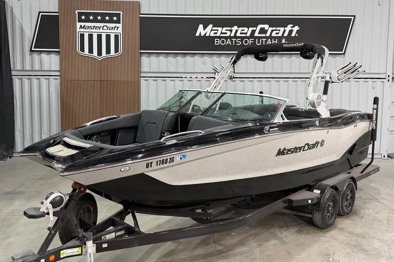 The Image of 2019 MasterCraft X24 boat on trailer in showroom, Utah dealership. - 1