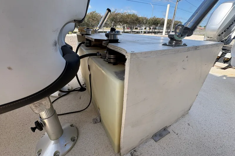 Slide: The Image of 2019 Carolina Skiff 24 DLX boat interior, featuring seating and storage components. - 18
