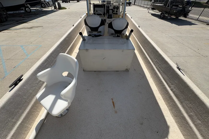 Slide: The Image of 2019 Carolina Skiff 24 DLX boat interior with seating and control console. - 15