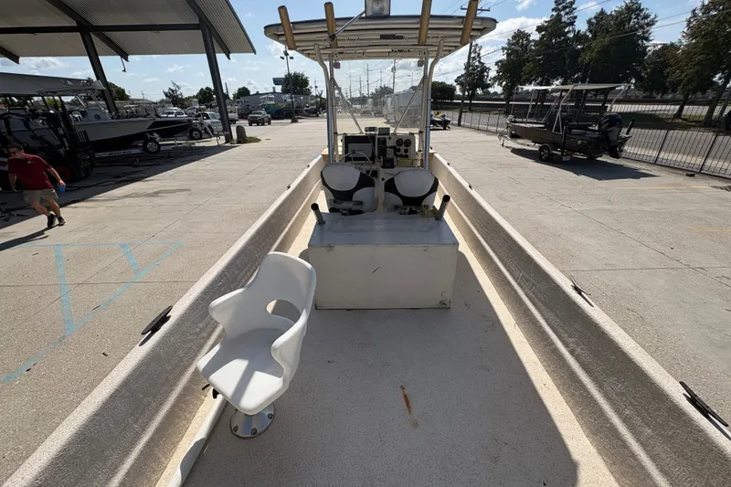 Slide: The Image of 2019 Carolina Skiff 24 DLX boat interior with seating and control console. - 21