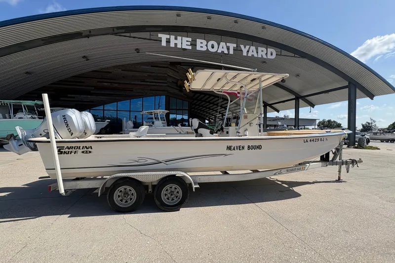 Slide: The Image of 2019 Carolina Skiff 24 DLX boat on trailer at The Boat Yard. - 3