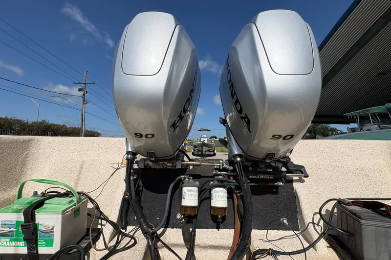Slide: The Image of Twin Honda 90 outboard engines on a 2019 Carolina Skiff 24 DLX boat. - 20