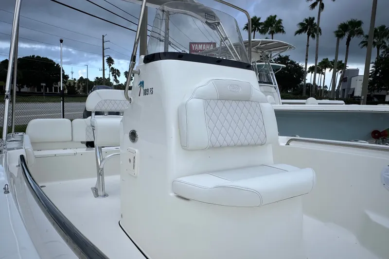 Slide: The Image of 2027 Key West 189 FS boat interior with white seating and console. - 16