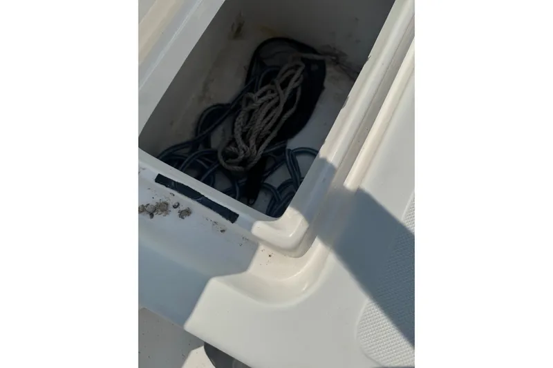 Slide: The Image of Storage compartment with ropes on a 2009 Carolina Skiff 218 DLV boat. - 14