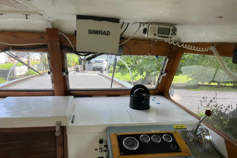 Slide: The Image of Interior view of a 1970 Dyer 29 boat cockpit with navigation equipment. - 21