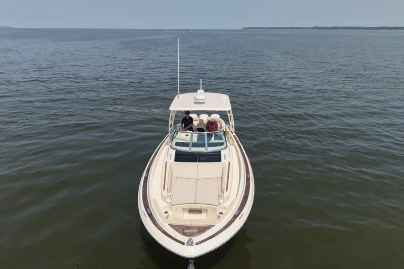 Slide: The Image of 2016 Chris-Craft Launch 36 boat cruising on open water, aerial view. - 15