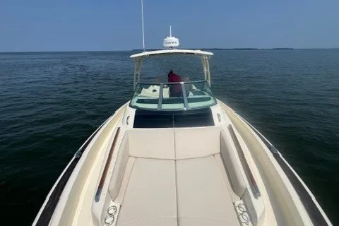 Slide: The Image of 2016 Chris-Craft Launch 36 boat cruising on open water under clear skies. - 20