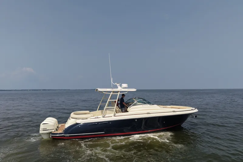 Slide: The Image of 2016 Chris-Craft Launch 36 boat cruising on open water under clear skies. - 10