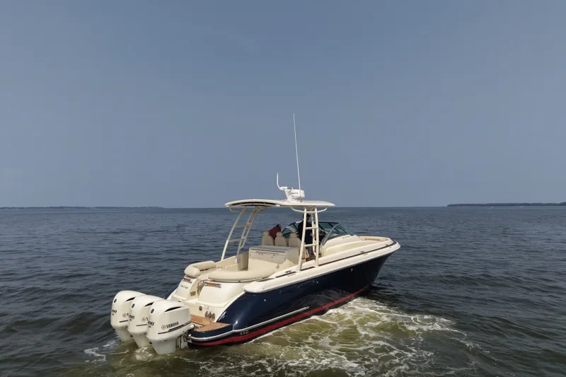 Slide: The Image of 2016 Chris-Craft Launch 36 boat cruising on open water. - 13