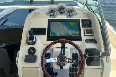 Slide: The Image of 2016 Chris-Craft Launch 36 dashboard with navigation system and controls. - 18