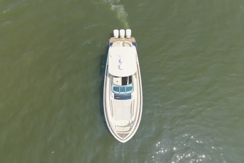 Slide: The Image of Aerial view of 2016 Chris-Craft Launch 36 boat cruising on open water. - 16