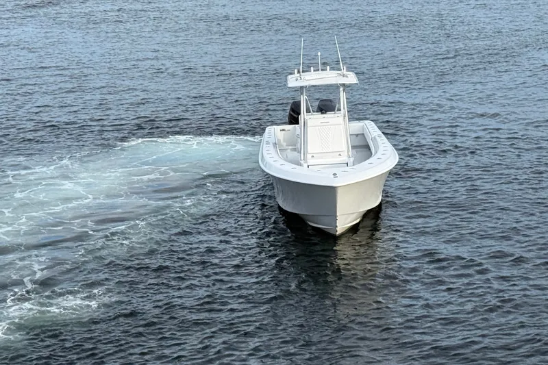 Slide: The Image of 2011 Contender 35 ST boat cruising on open water. - 4