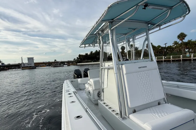 Slide: The Image of 2011 Contender 35 ST boat on water, featuring sleek design and modern amenities. - 13