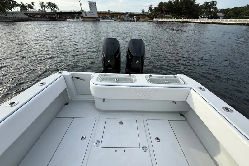 Slide: The Image of 2011 Contender 35 ST boat with dual engines on calm water. - 17