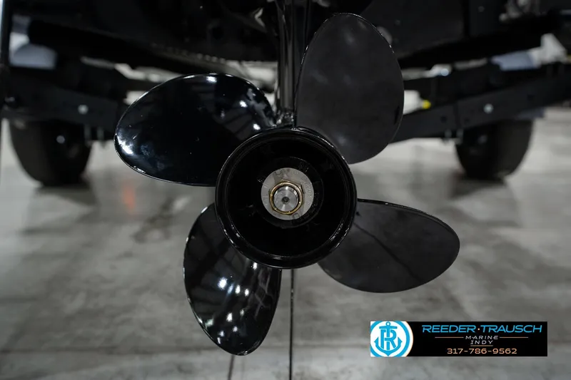 Slide: The Image of Close-up of a 2026 Lund 1875 Renegade boat propeller in a showroom. - 55