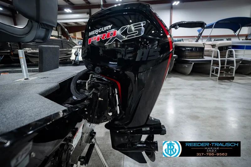 Slide: The Image of 2026 Lund 1875 Renegade boat with Mercury Pro XS outboard motor in showroom. - 52