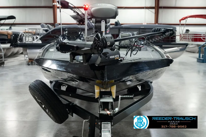 Slide: The Image of 2026 Lund 1875 Renegade boat with Minn Kota motor in showroom. - 2