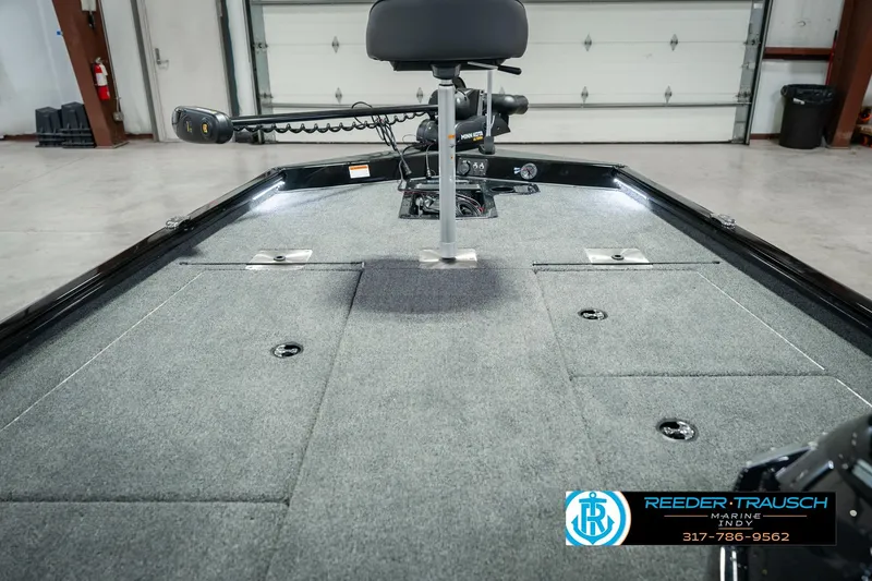 Slide: The Image of 2026 Lund 1875 Renegade boat interior with carpeted deck and fishing seat. - 30