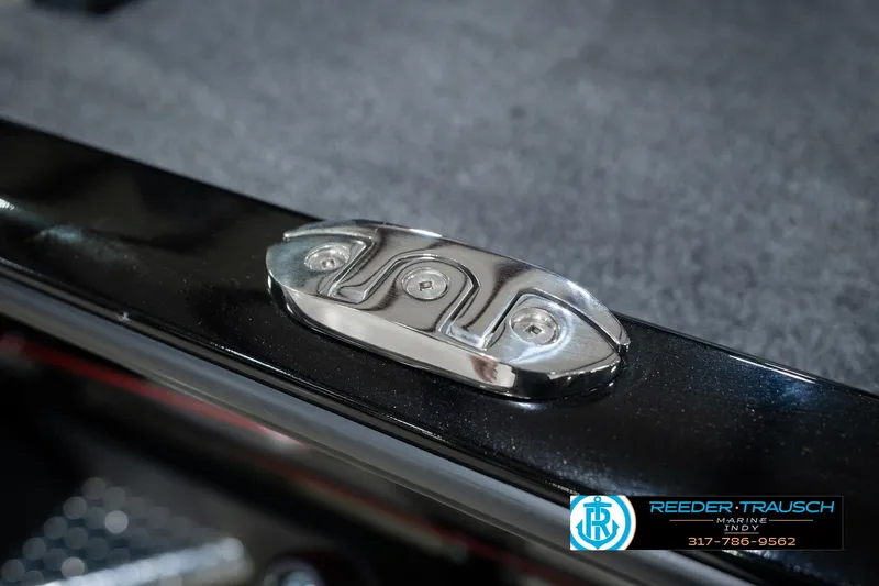 Slide: The Image of 2026 Lund 1875 Renegade boat detail with metallic fixture, Reeder-Trausch Marine logo visible. - 65