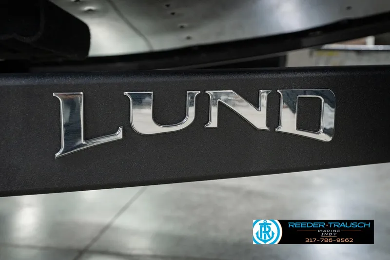 Slide: The Image of Close-up of 2026 Lund 1875 Renegade logo on a boat trailer. - 63