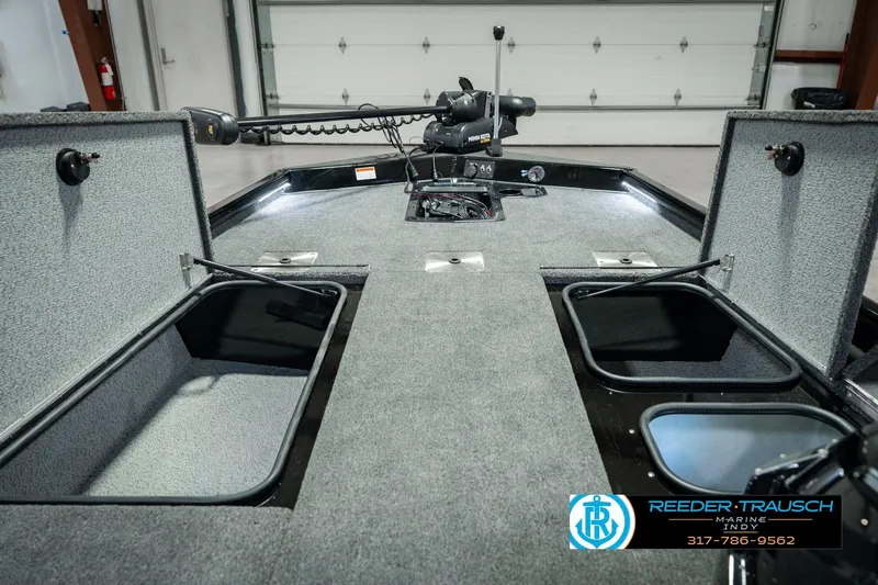 Slide: The Image of 2026 Lund 1875 Renegade boat interior with storage compartments and trolling motor. - 33