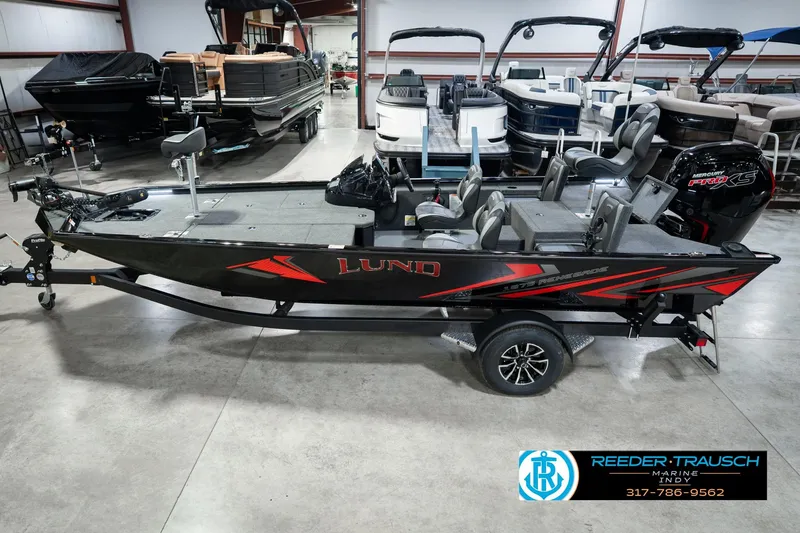 The Image of 2026 Lund 1875 Renegade fishing boat in showroom, featuring sleek design and modern amenities. - 0
