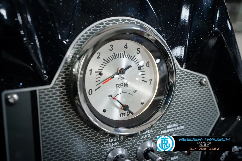 Slide: The Image of Close-up of 2026 Lund 1875 Renegade boat RPM gauge and controls. - 39