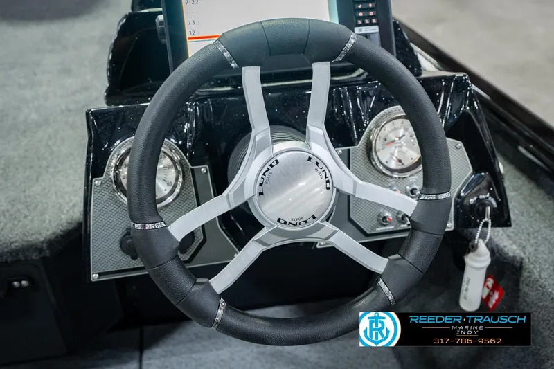 Slide: The Image of Steering wheel of 2026 Lund 1875 Renegade boat with dashboard instruments. - 35