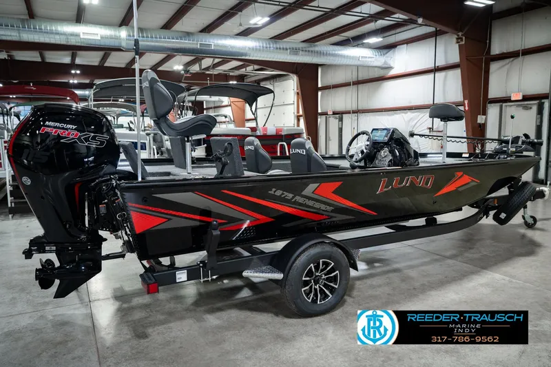 Slide: The Image of 2026 Lund 1875 Renegade boat with Mercury Pro XS engine in showroom. - 6