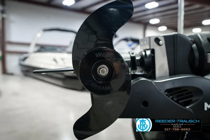 Slide: The Image of Close-up of a 2026 Lund 1875 Renegade boat propeller in a showroom. - 58