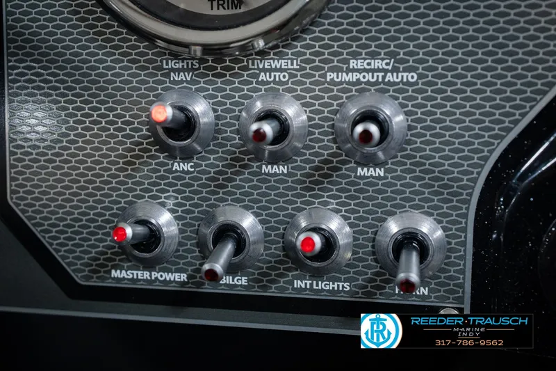 Slide: The Image of Control panel of 2026 Lund 1875 Renegade boat with labeled switches. - 40