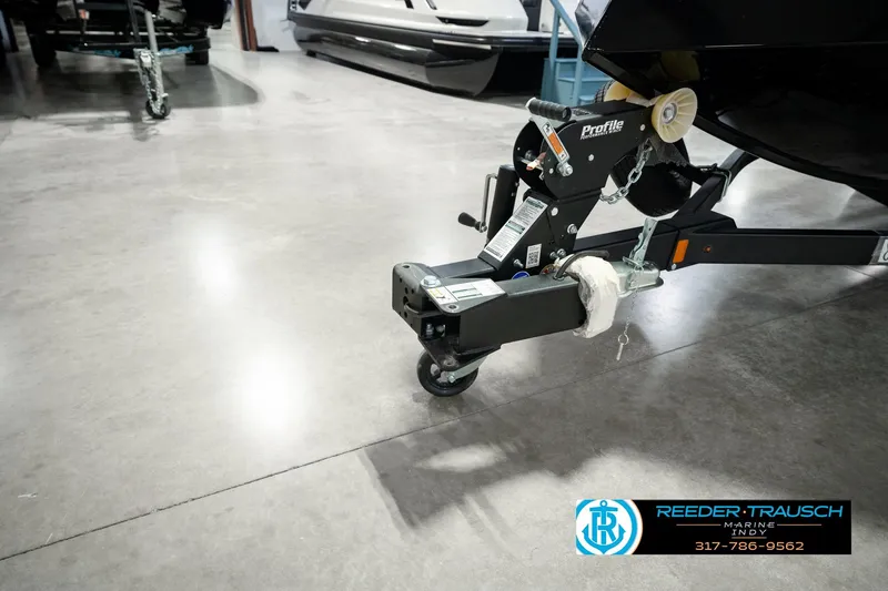 Slide: The Image of Trailer hitch of 2026 Lund 1875 Renegade boat in showroom, Reeder Trausch Marine. - 62