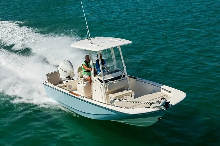 The Image of Manufacturer Provided Image: 2026 Boston Whaler 210 Montauk boat cruising on clear blue water. - 1