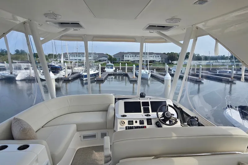 Slide: The Image of Interior view of 2021 Tiara Yachts F44 Flybridge at marina dock. - 47