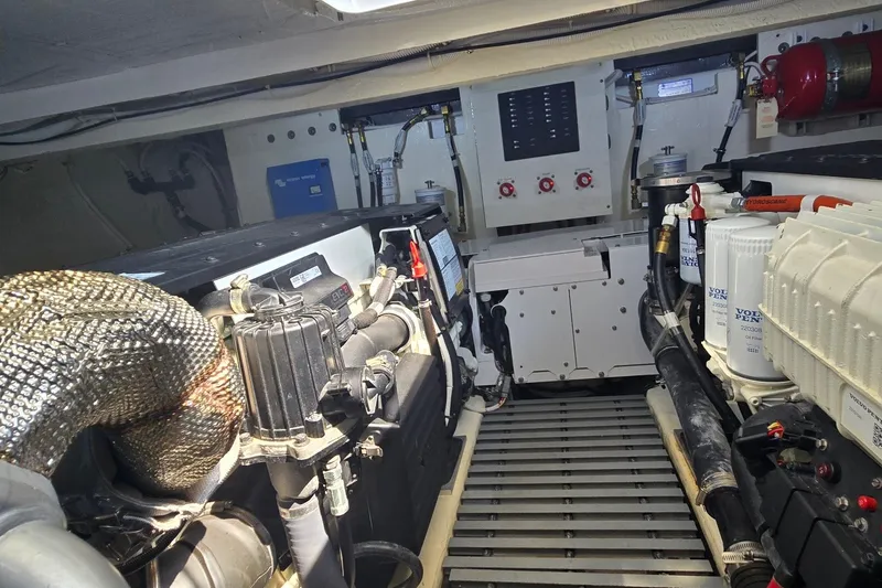 Slide: The Image of Engine room of 2021 Tiara Yachts F44 Flybridge, showcasing mechanical components and systems. - 52