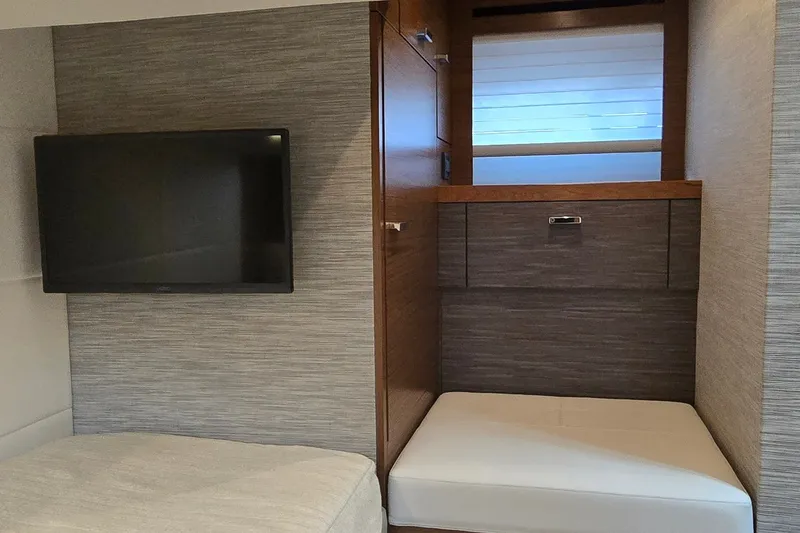 Slide: The Image of 2021 Tiara Yachts F44 Flybridge interior with TV and seating area. - 33
