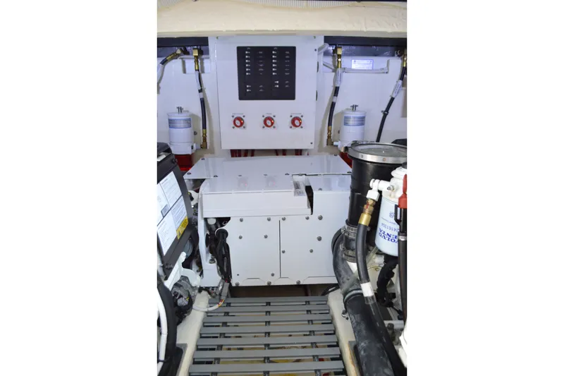 Slide: The Image of Engine room of 2021 Tiara Yachts F44 Flybridge, showcasing mechanical components and systems. - 55