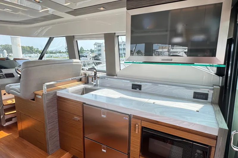 Slide: The Image of Luxurious interior of 2021 Tiara Yachts F44 Flybridge with modern kitchen amenities. - 22