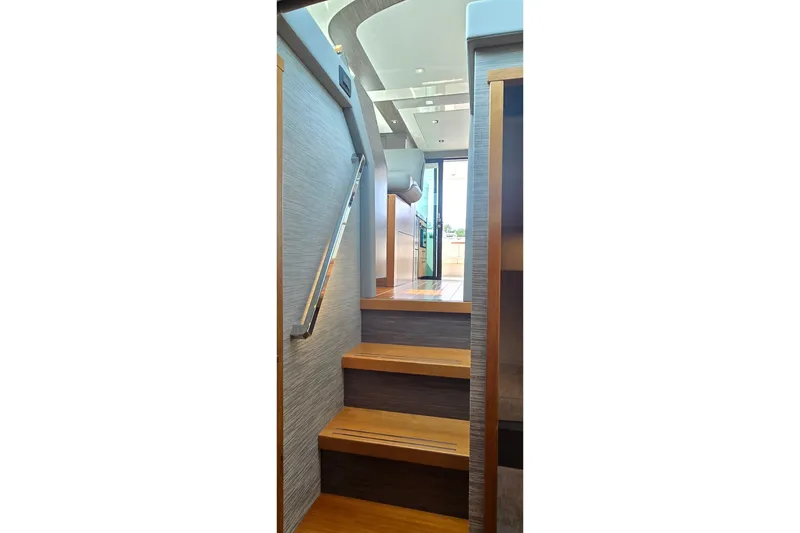 Slide: The Image of Staircase inside 2021 Tiara Yachts F44 Flybridge, leading to upper deck. - 37