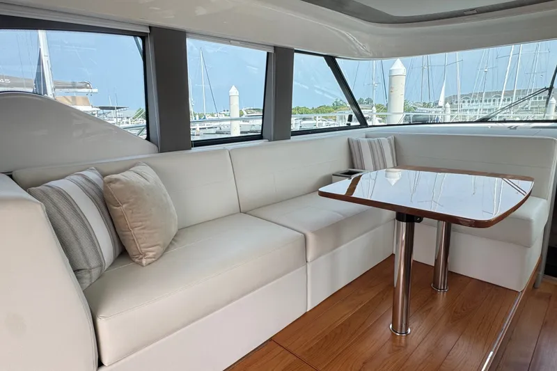 Slide: The Image of Luxurious interior of 2021 Tiara Yachts F44 Flybridge with elegant seating and wooden table. - 15