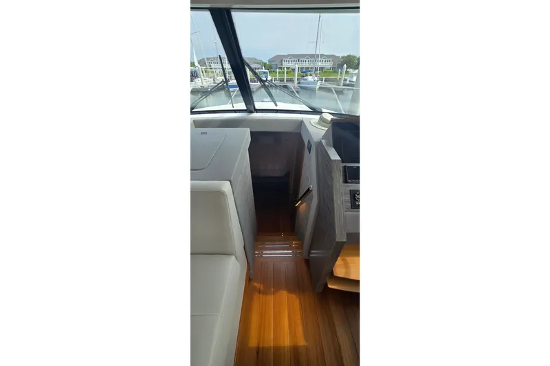 Slide: The Image of Interior view of 2021 Tiara Yachts F44 Flybridge with sleek wood flooring. - 36