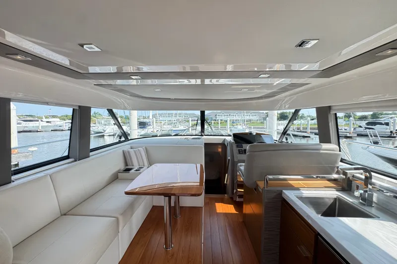 Slide: The Image of Luxurious interior of 2021 Tiara Yachts F44 Flybridge with elegant seating and modern amenities. - 11